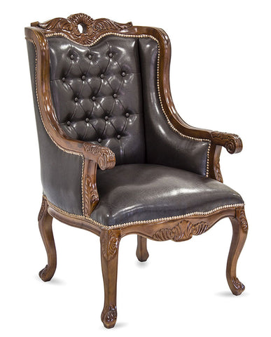 Chippendale stílusú, tömör mahagónifából készült, fekete műbőr kárpitozású, kézműves füles fotel.