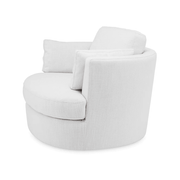 Fehér szövet fotel bal oldali nézetből, párnával és ívelt háttámlával.