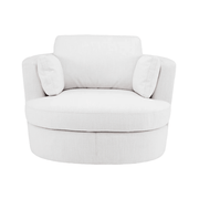 Fehér, szövetkárpitozású, forgó design fotel elölről, párnákkal.