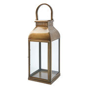 Rozsdamenetes acélból készült, sárgarézszínű lámpás.