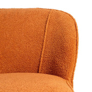 Kárpit részlete – bouclé textúra a CLUB EMMA terrakotta fotelen.