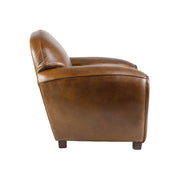 Jobboldali profilból fotózott Club Paquebot fotel, amely kiemeli a klasszikus klubfotelekre jellemző letisztult sziluettet.