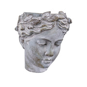 Szürke színű, falra helyezhető női kaspó büszt.