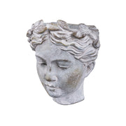 Szürke színű, falra helyezhető női kaspó büszt.