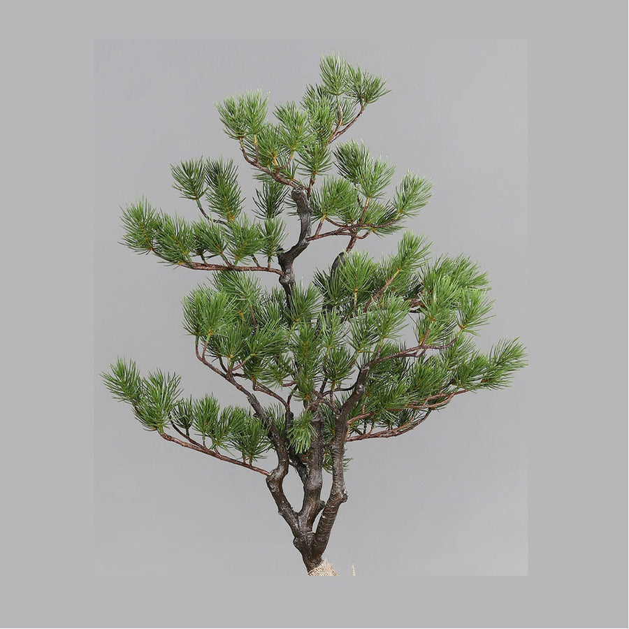 Jutazsákba helyezett dekorációs műfenyő.