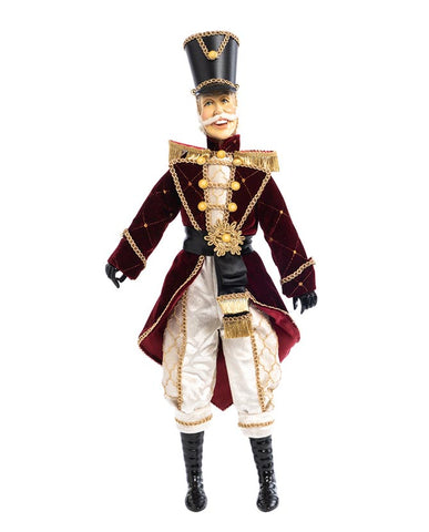 Burgundi és krémszínű, kézműves diótörő katona figura.
