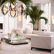 Krémszínű buklé szövettel kárpitozott, prémium minőségű, formatervezett design kanapé,