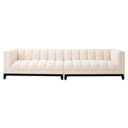 Krémszínű buklé szövettel kárpitozott, prémium minőségű, formatervezett design kanapé.