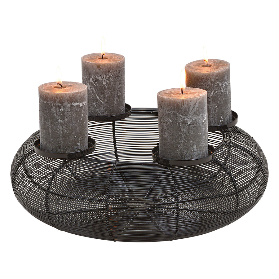 Fekete színű, adventi gyertyatartó.