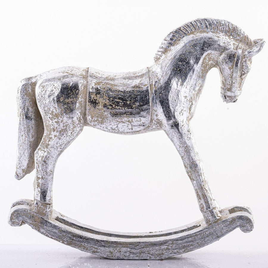 Antikolt felületű, ezüst színű karácsonyi hintaló figura.