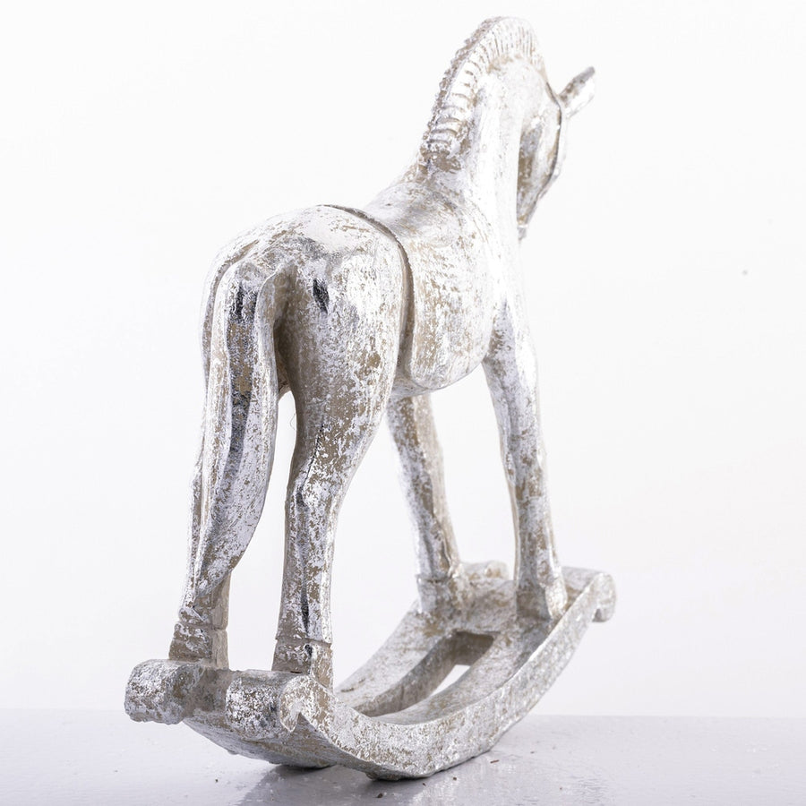 Antikolt felületű, ezüst színű karácsonyi hintaló figura.