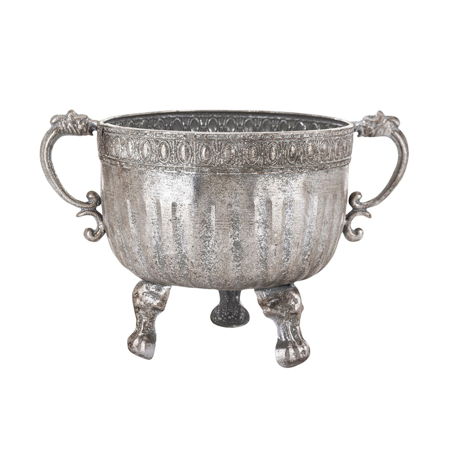 Ezüstszínű, dombormintával díszített, lábakon álló fém kaspótál.