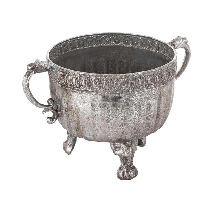 Ezüstszínű, dombormintával díszített, lábakon álló fém kaspótál.