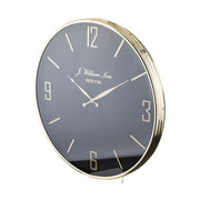 Fekete-arany színű falióra.