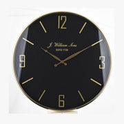 Fekete-arany színű falióra.