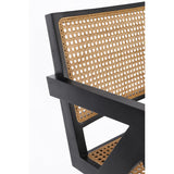 Fekete színű, teakfából és rattanból készült, formatervezett design fotel.
