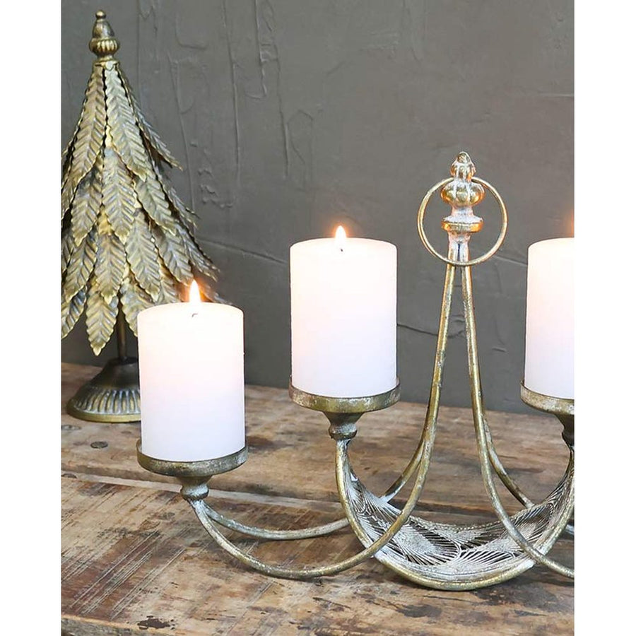 Rézszínű fémből készült, 4 ágú adventi gyertyatartó.