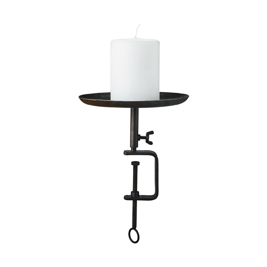 Fekete színű, vasból készült, kézműves gyertyatartó.
