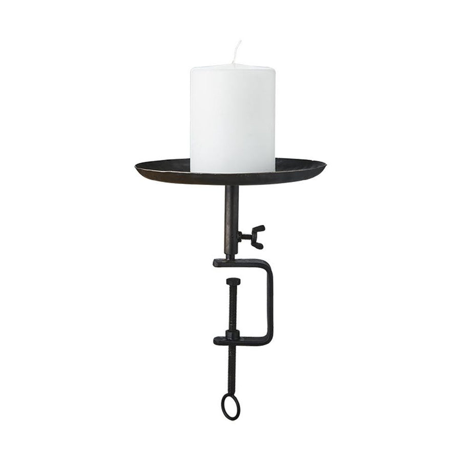 Fekete színű, vasból készült, kézműves gyertyatartó.