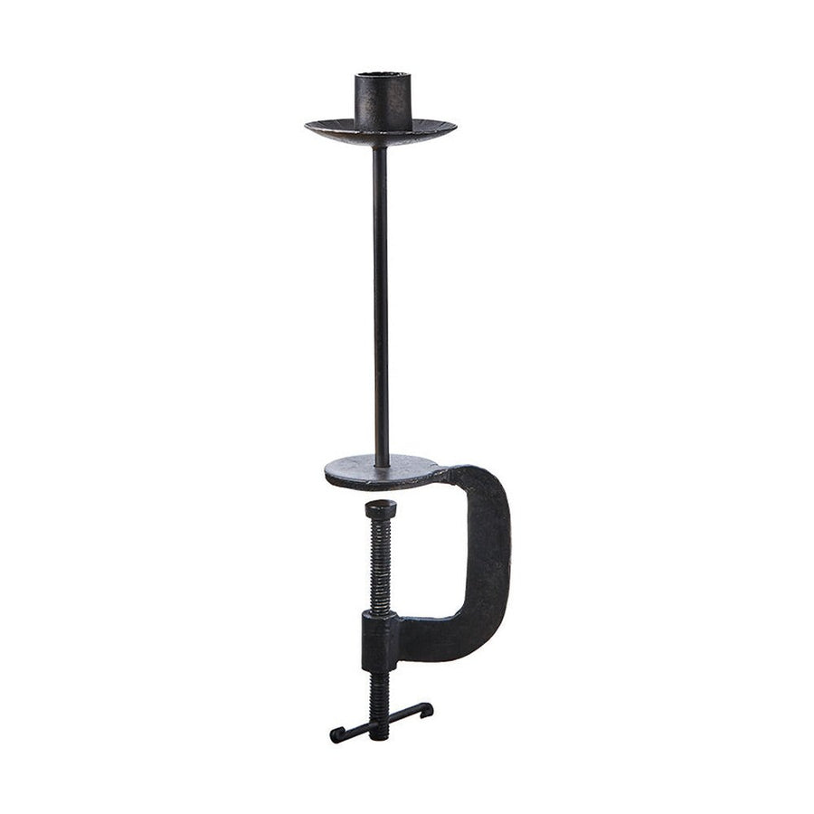 Fekete színű, vasból készült, kézműves gyertyatartó.