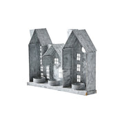 Szürke színű, bádogból készült házikókat formázó lámpás.