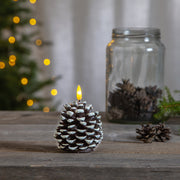 Havas fenyőtoboz formájú LED gyertya.