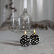 Havas fenyőtoboz formájú LED gyertya.