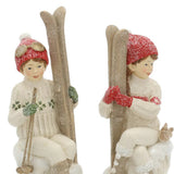 Heritage fehér karácsonyi síléces gyerek figurák közeli részletfotó, kötött ruházattal