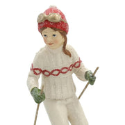 Heritage fehér karácsonyi síelő kislány figura részletfotó, kötött ruha és piros sapka