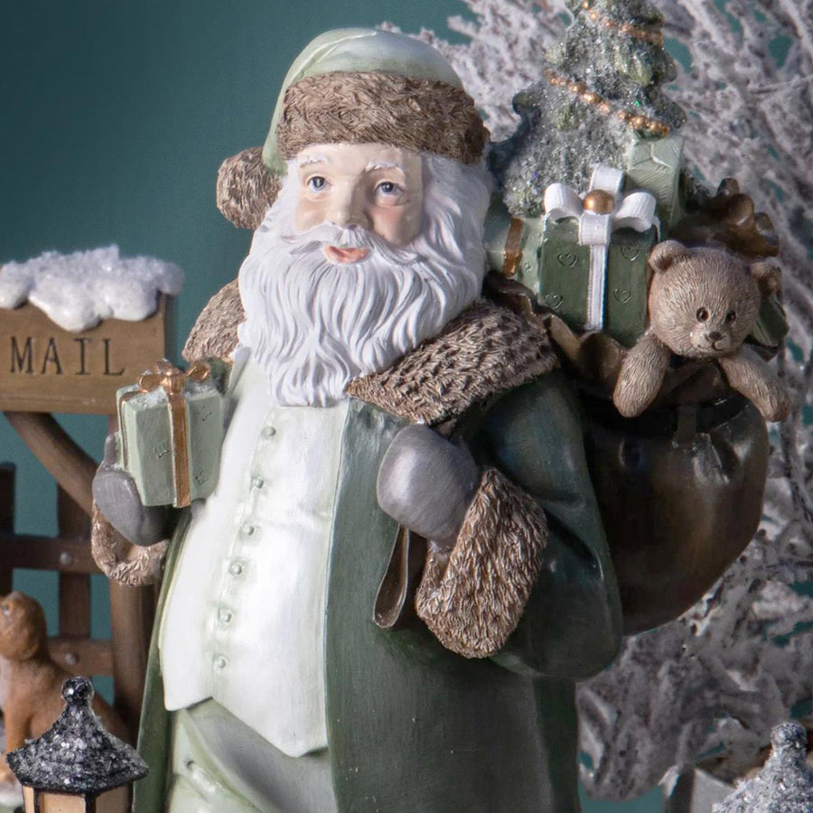 Vintage stílusú zöld Mikulás figura ajándékokkal és plüssmackóval