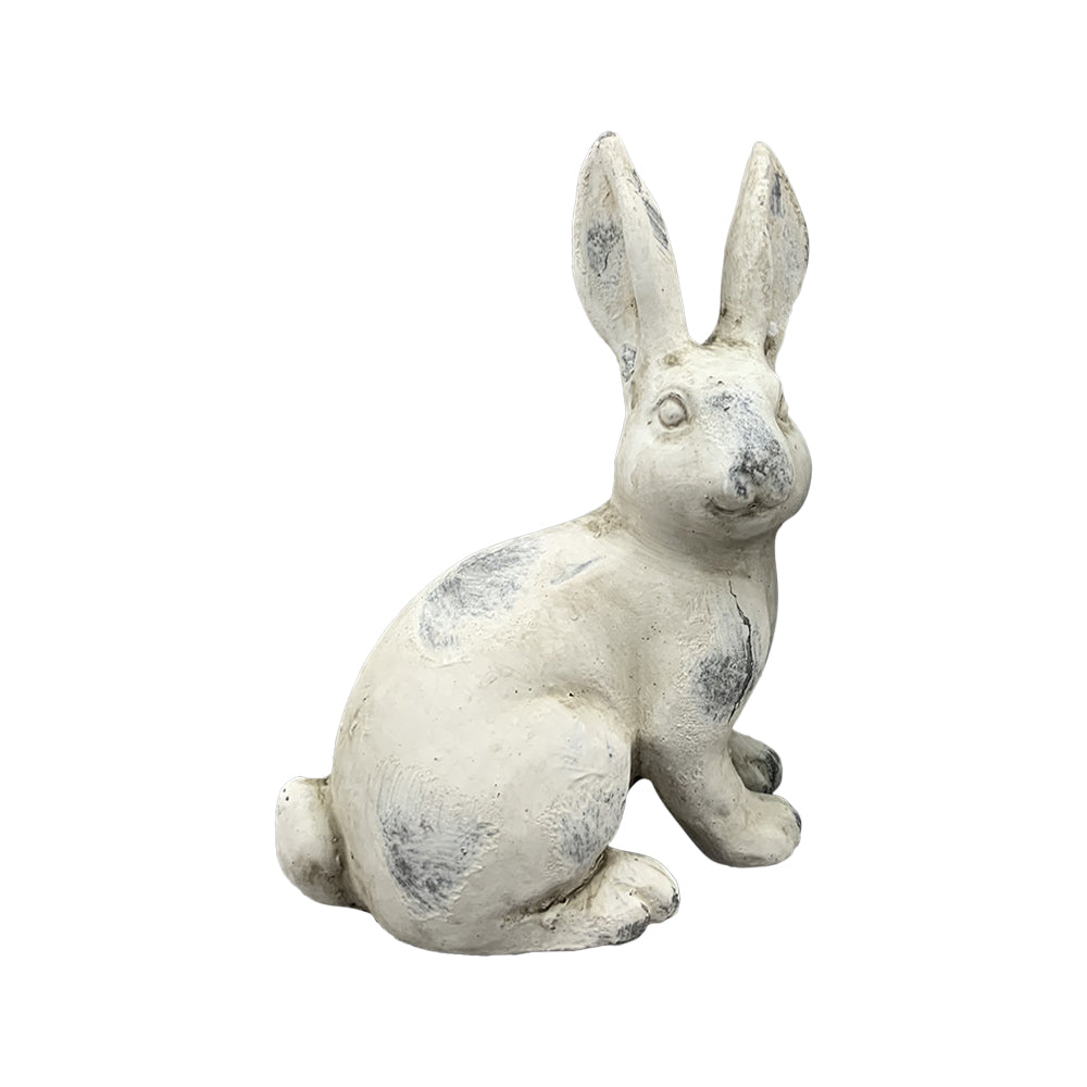 Antikolt felületű, krémszínű húsvéti nyuszi figura.
