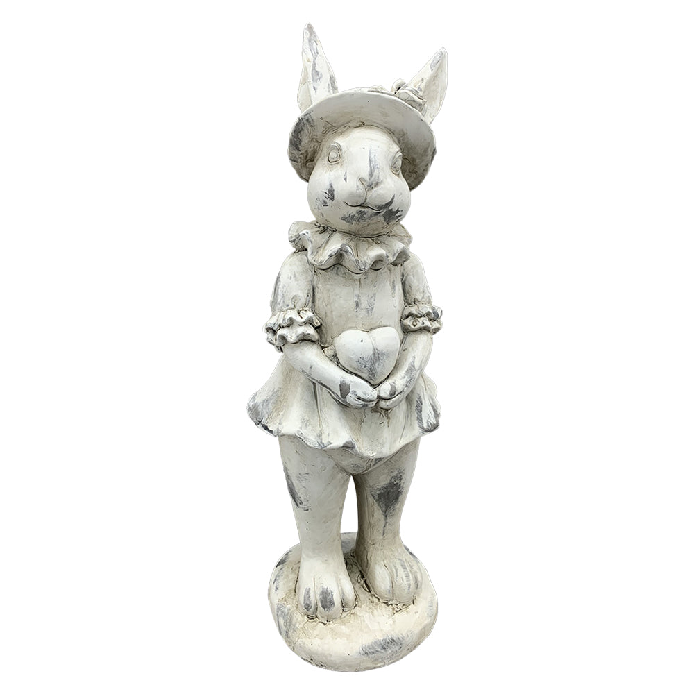 Antikolt felületű, krémszínű húsvéti nyuszilány figura.