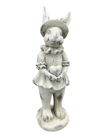 Antikolt felületű, krémszínű húsvéti nyuszilány figura.