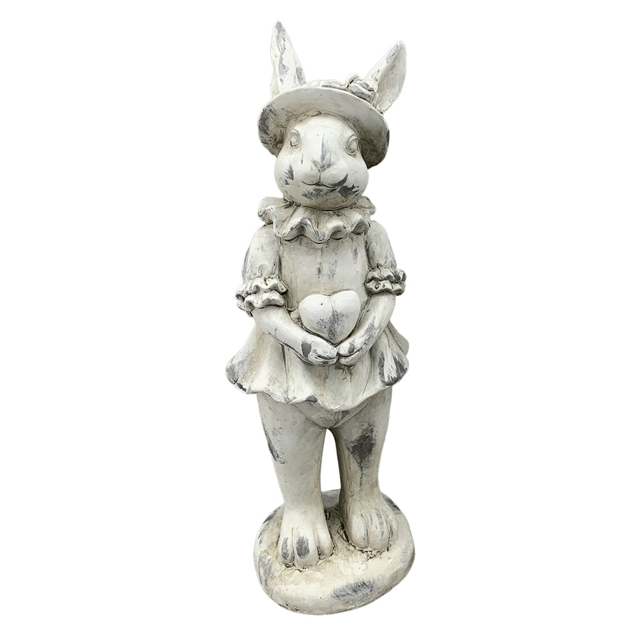 Antikolt felületű, krémszínű húsvéti nyuszilány figura.