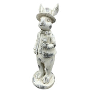 Antikolt felületű, krémszínű húsvéti nyuszifiú figura.