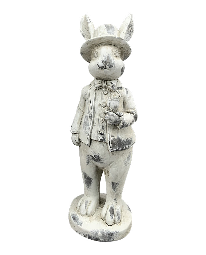 Antikolt felületű, krémszínű húsvéti nyuszifiú figura.