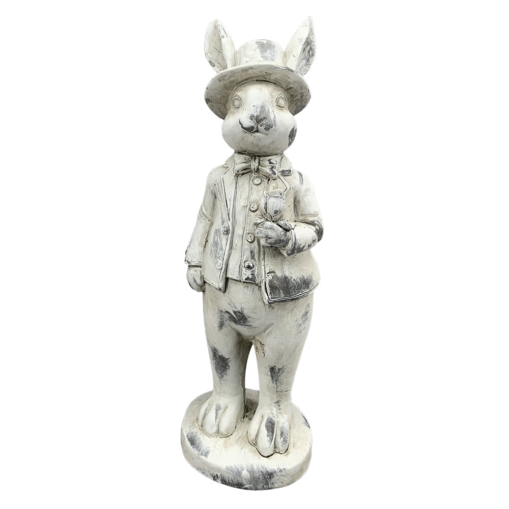 Antikolt felületű, krémszínű húsvéti nyuszifiú figura.