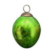 Függeszthető kialalkítású, zöld színű húsvéti üvegtojás.