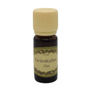Gránátalma illatú illóolaj 10 ml-es barna üvegcsében, krémszínű kupakkal – gyümölcsös és frissítő aromával, párologtatásra.