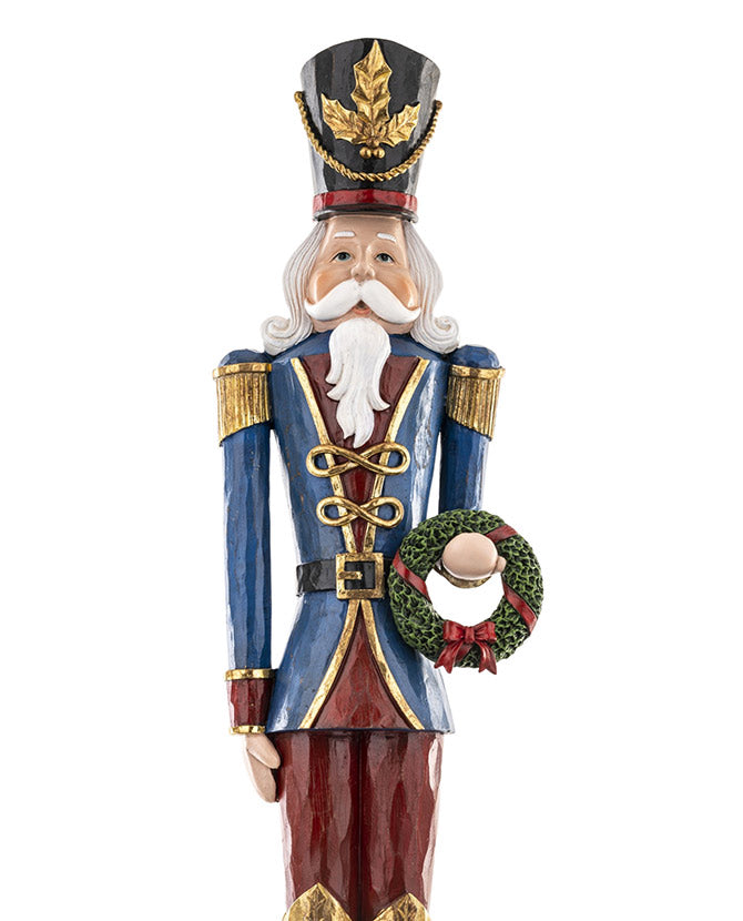 kék és bordó színárnyalatú, faragott fa hatású karácsonyi diótörő figura