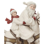 Karácsonyi hintaló Télapóval és kisfiúval.