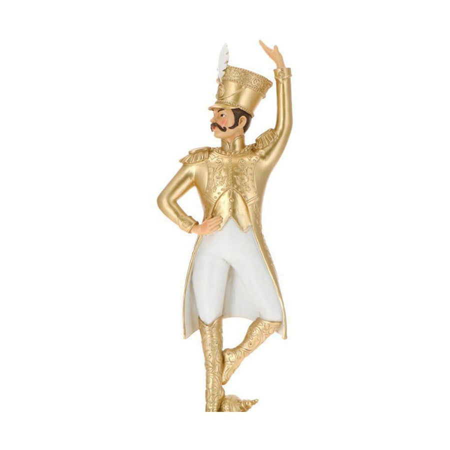 Arany és fehér színárnyalatú, táncoló karácsonyi katona figura.