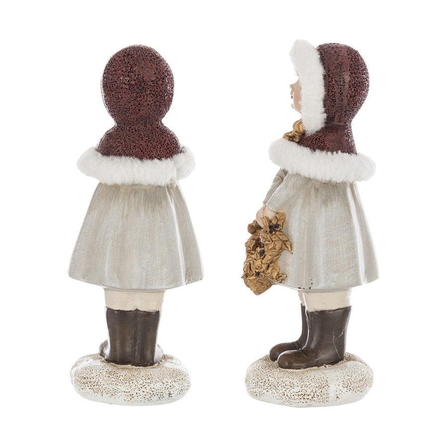 Krémszínű karácsonyi kislány figura.