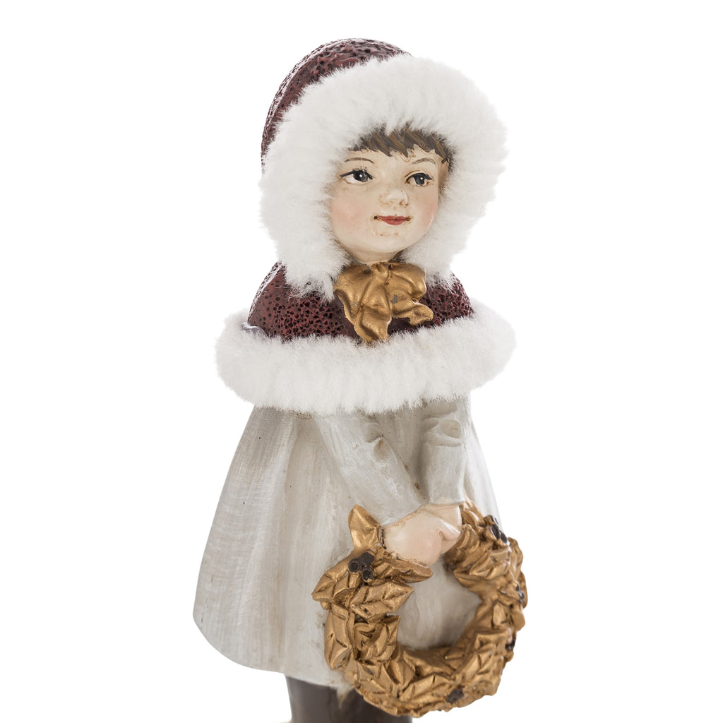 Krémszínű karácsonyi kislány figura.