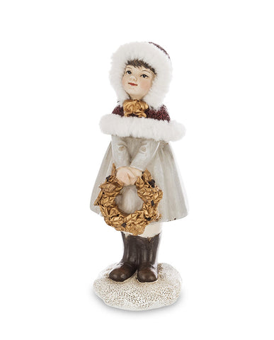Krémszínű karácsonyi kislány figura.