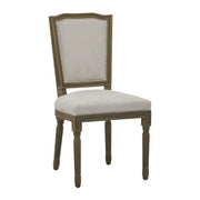 Világosszürke színű szövettel kárpitozott, koloniál stílusú kézműves étkezőszék.