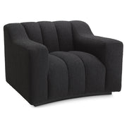 Fekete színű buklé szövettel kárpitozott dizájn fotel.