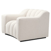 Krémszínű buklé szövettel kárpitozott dizájn fotel .