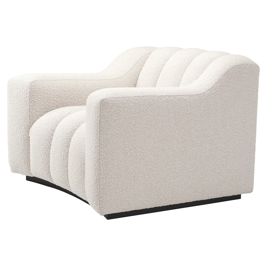 Krémszínű buklé szövettel kárpitozott dizájn fotel .