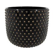 Fekete színű, mázas kerámiából készült kaspó.